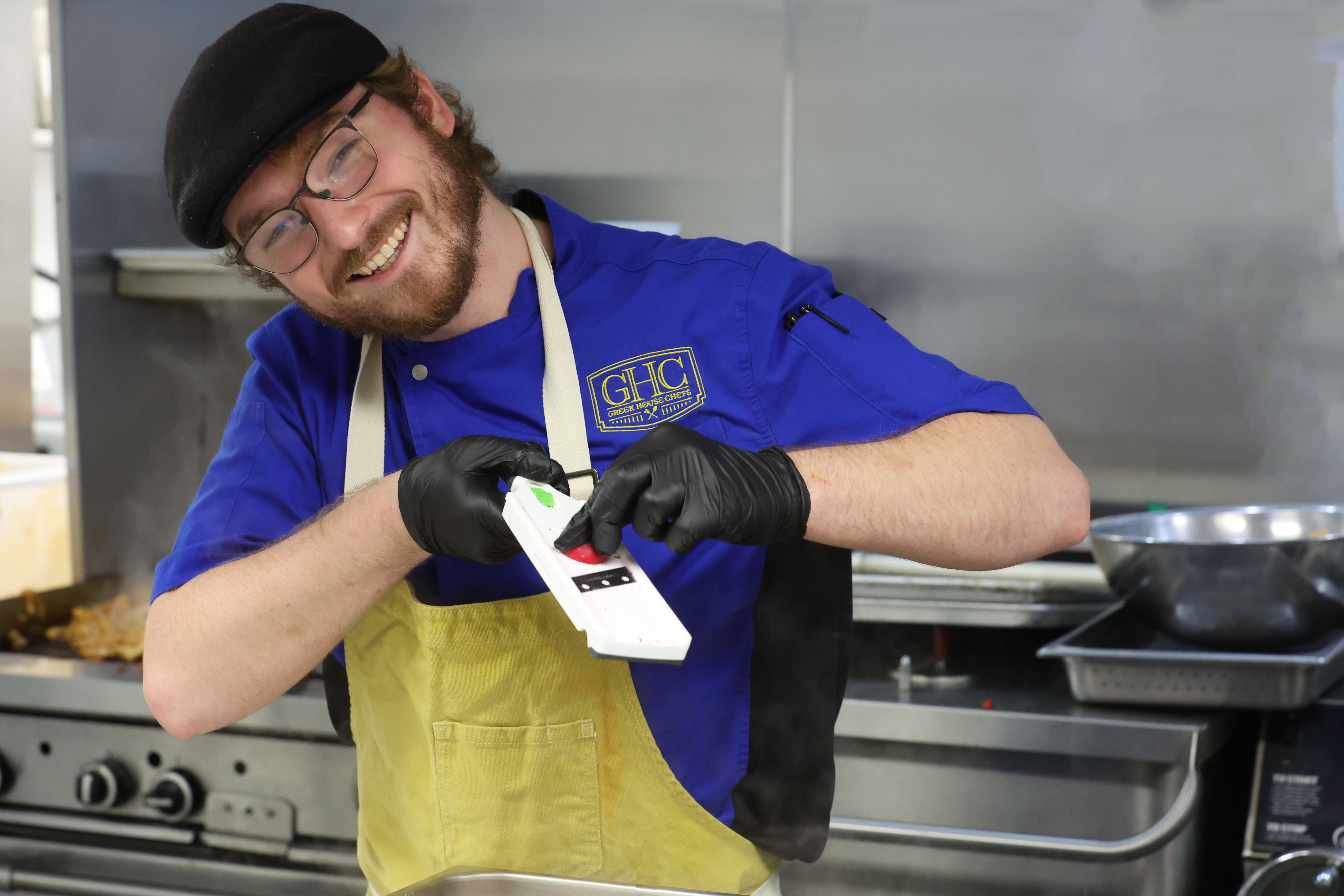 Greek House Chef using mandolin